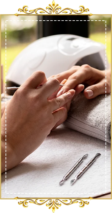 Professional nail technician applying manicure treatment to client
